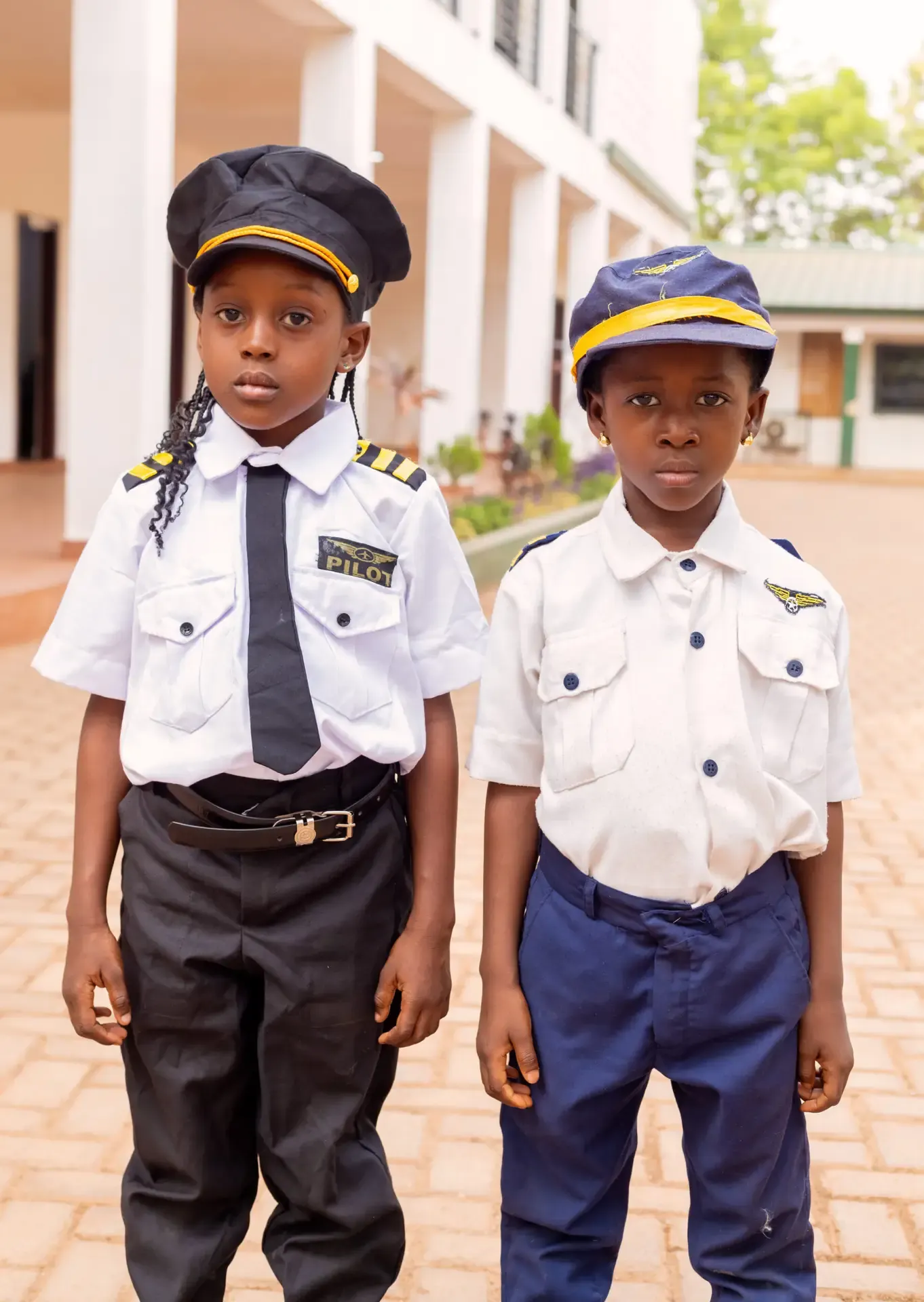 Two young pupils dressed as airline pilots