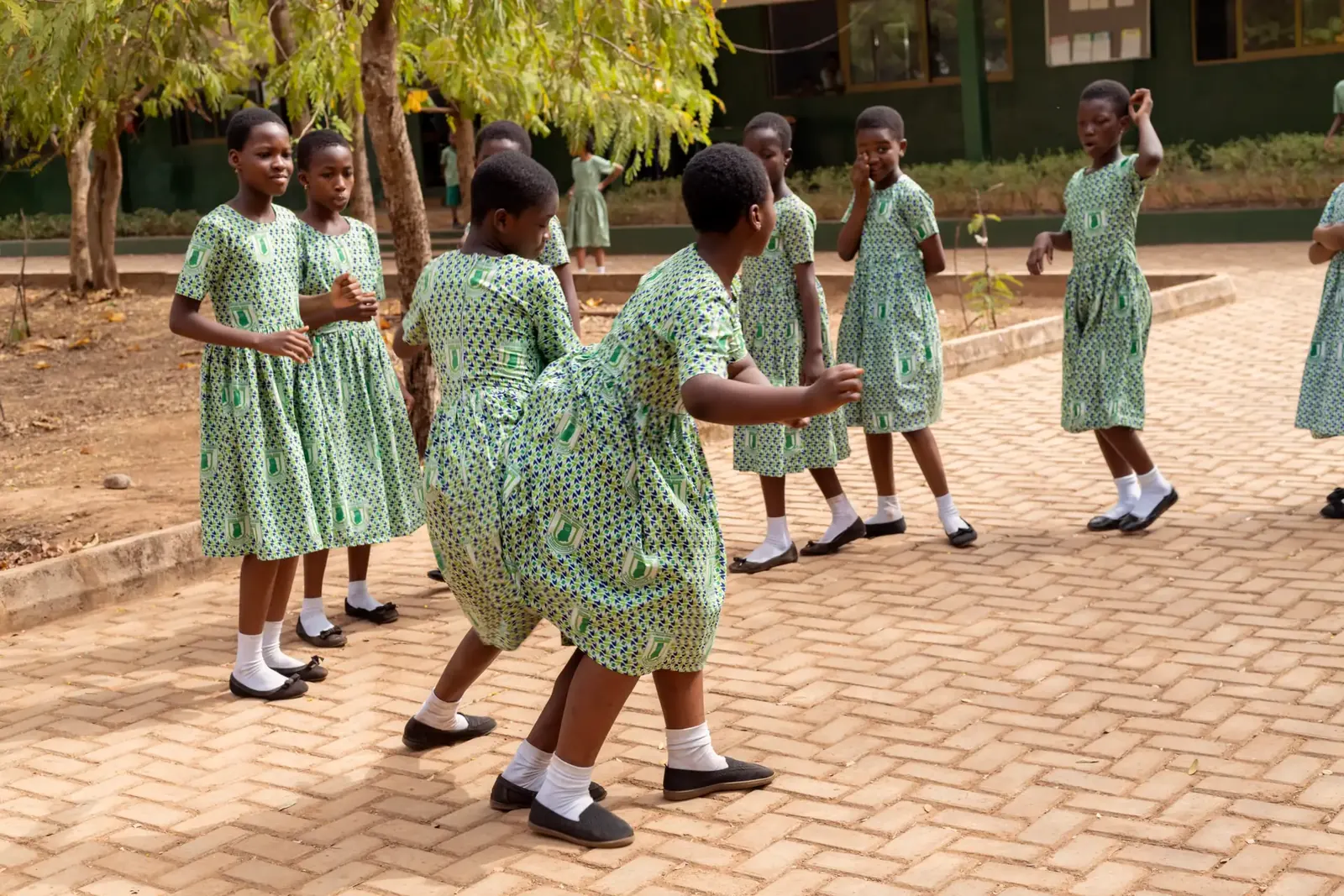 Pupils dancing in a circle on Cultural Day